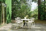 Outside, Kartell Masters chairs surround a Tom Dixon Screw table.