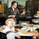 A Saarinen tulip table is the perfect height for snacking on kid-appropriate apple slices and crackers in architect Cass Calder Smith’s New York high-rise.  Search “restaurants-of-cass-calder-smith.html” from Steps to a Party-Ready Modern Home