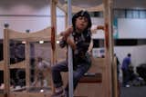 Modern jungle gyms are the order of the day, with loads of tots swinging and jumping from designs by Modern Playhouse and CedarWorks.
