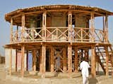 In the aftermath of a 2005 earthquake in Pakistan, Lari develeoped a bamboo shelter system called KaravanRoof, built with adobe-and-mud walls and strong bamboo cross-bracing.