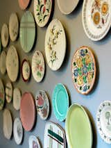 Part of an ongoing motif, vintage and thrifted plates are set up throughout the interior of rooms and in several of the hallways.