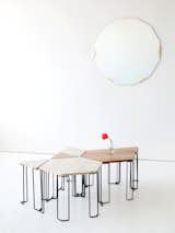 The Bradford table plays to the theme of individual pieces that can be grouped as a whole. Prices range from $610 for the triangular wood-topped table to $1,290 for the stone hexagon; the bases are blackened steel.