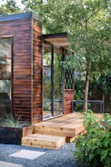 In addition to charred-wood siding—shown here in the cherry stain—Sett Studio can also add decking and landscaping.