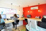 Office and Desk For the realty group interior space, eight people comfortably work in the 12-foot-by-14-foot room. There’s a mini slit A/C and heating system, painted sheetrock walls and bamboo floors and desk.  Search “building a prefab house” from On Your Mark, Get Sett