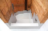 An exterior staircase descending from one of the roof gardens. The stair treads will be installed later but first the waterproofing goes in. Here the Versico PVC membrane seals the stair area before the Tyvek and other paper wrap is installed on the walls.