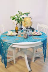 Scarves instead of tablecloths can be an easy and colorful alternative.
