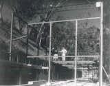 Charles and Ray on the steel frames of their home while it was under construction in 1949.