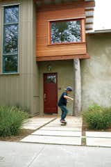 Outdoor, Shrubs, and Pavers Patio, Porch, Deck  Search “do-more-with-your-door-dwell-finalists.html” from Green Zero-Energy Family Home in Santa Cruz