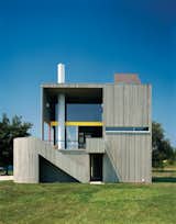 The wood-frame residence and studio are clad in vertical cedar siding—back then, a daring competitor to clapboard—instead of concrete to save costs. The effect is equally seamless, however: “If you drive by it fast enough,” Charles Gwathmey once said, “you still might mistake it for a concrete house.”