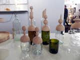 Italian brand Slow Design employs the skills of Tuscan artisans to transform old glass bottles into new decorative vessels with lids turned from local ash and olive wood.  Photo 9 of 15 in Into the Woods at Maison & Objet 2012 by Ali Morris