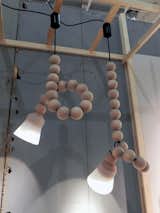 Twenty giant wooden beads are strung onto the cord of Berlin-based design studio Llot Llov’s Earl lamp. The idea is that the angle and the height of the lamp can be easily adjusted by looping the cable around the beads.  Photo 12 of 15 in Into the Woods at Maison & Objet 2012 by Ali Morris