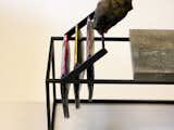 The magazine rack is also made of welded steel, and though it fits over the top of the frame it can easily be removed.