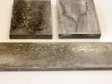The finished slabs can take on a couple different qualities. The one on the top left "has an organic feel to it that's more on the surface of the concrete," Howe says. "The one on the top right has more tonality throughout the thickness of the piece. I started off trying to make it look like granite. But now I'm trying out some controlled imperfections."