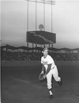 Sandy Koufax, perhaps the team’s greatest pitcher, warms up in front of the park’s classic butterfly awnings in 1964. All photos courtesy L.A. Dodgers.