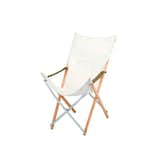 This indoor-outdoor version of the iconic butterfly chair has a washable white canvas seat and frame made from laminated bamboo and aluminum for durability. Long Take chair by Snow Peak.