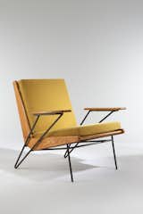 Armchair, 1953. Ash, black enameled metal, upholstered. By Pierre Guariche.