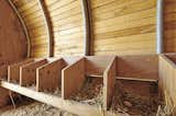 Radiant heating, one of the structure's amenties, is a coop must-have, according to Cassell.  Search “chicken chapel” from Modern Chicken Coop Looks Like a Mini Avian Airstream