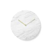 Refined and elegant, the Marble Wall Clock features simple, clean lines. Designed by Norm Architects, the clock is stripped of unnecessary details and focuses instead on the marble face and simple hands, which are crafted from lacquered brass. The marble and brass provide a subtle material play that elevates the clock’s overall aesthetic.