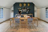 Kitchen, Wood Counter, Light Hardwood Floor, and Pendant Lighting In the kitchen area and throughout the home, Mads Odgård, shown here, and Mette Lyng Hansen mixed Odgård’s pieces, such as the Odgård kettle for Raadvad and custom table, with Ikea basics  and the Workshop pendant lamp by Louis Poulsen.  Search “fgf김포출장샵카톡FK456김포출장만남김포콜걸샵김포콜걸MMM김포출장아가씨김포출장마사지-김포출장안마김포출장업소24시VIP출장애인대행BBB김포출장샵추천” from Modern Meets Traditional in a Swedish Summer House