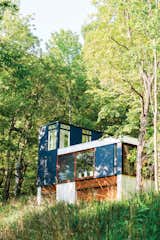 Johnsen oriented the building vertically to minimize the amount of grading and landscaping necessary for construction.  Photo 2 of 5 in The Durable Yet Comfortable Cabin in the Woods