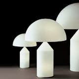 Designed by Vico Magistretti in 1977, the Atollo 237 Table Lamp has become an icon of Italian lighting design. The lamp was awarded the Compasso d’Oro in 1979 and has been placed in the permanent collections of many major design museums. Defined by its geometric details, the Atollo is comprised of a cone, cylinder, and semisphere, creating a design that is at once simple and sculptural.