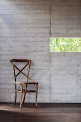 Sawn wood planks add texture to the interior walls.