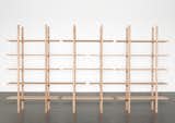 L' étagère en bois by Swiss designer Lucien Gumy is a solid wood shelving unit that requires zero screws or nails—each of the boards and uprights interlock perfectly. The overall size can be varied by using differing lengths of elements.