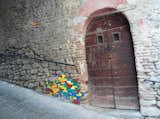 Spied on the Archiculture blog: a centuries-old cobbled wall appears to enjoy a little extra support by way of Lego. (Notice the toys filling various nooks and crannies, too.)