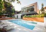 Thellend Fortin Architectes designed this two-story addition in the OUtremont neighborhood of Monteal to capture views from the steeply sloping lot.