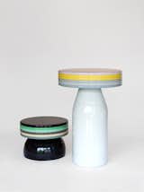 The line also includes side tables and stools that are wrapped in colorful bands.