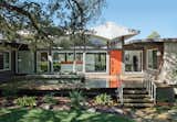 This 1960s home in Austin is nicknamed the Butterfly House for its dramatic awning.  Photo 6 of 6 in Amazing Ranch House Renovations by Luke Hopping from Instantly Appealing Awnings