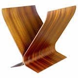 Bent rosewood pieces, layered and finished with a mahogany veneer, lend this piece a warm richness that hasn't faded a bit since it was constructed in the 1960s. For more information, contact Assemblage.