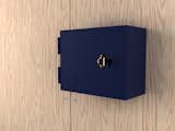 Architect and designer Jonas Wagell has drawn inspiration from bank safe deposit boxes for his key cabinet Vault for Designtorget. The frame is in color-coated steel, while the brass handle is shaped like a old-fashioned key.