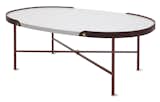 A dark brown leather edge runs around the Rink table by Eva Schildt for manufacturer Klong. The designer combines a metal frame, colored the same brown hue as the leather, with white stained ash tabletop and brass detailing.