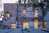 The building was rehabilitated for a human rights organization. A courtyard functions as public gathering space.  Photo 1 of 35 in Project 1 by Dianna Labrada from Modern Office Space Carved Out of a Crumbling Brick Building