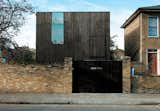 The Sunken House, so-named for its excavated site, is a dark, cedar-clad cube in a stuffy part of London, where weathered brick and clay chimney pots are more common than modernist angles. Locals have come to call it "Ed's Shed," after the owner, photographer Ed Reeve.