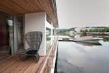 “It’s oriented for the river," says architect Adam Jirkal. “It doesn’t have an engine. We wanted it to be as low to the water as possible, to really work with the water.”  Search “the-x2700-shuttles-smallest-mini-pc-yet.html” from Floating Prefab Concept Rethinks the Houseboat