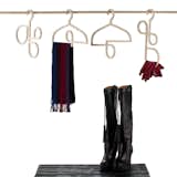 These small-closet-friendly, loopy Hangers & Footwear Mats are more than just cute: Unlike ordinary hangers, they allow you to organize scarves and gloves, too. Constructed from lightweight Russian cherry plywood in a trim profile.