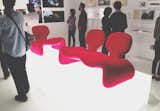 A trio of Djinn Chairs by French designer Olivier Mourgue from 2001: A Space Odyssey (1968), lay atop light boxes.