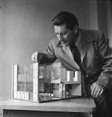Here, Rietveld plays around with a model of experimental housing designs. Look closely and you can see tiny versions of his Zig Zag chair at the dining room table. He was the first to apply the concepts of De Stijl to architecture, designing the Rietveld Schröder House in 1924.  Photo 2 of 7 in The Iconic Chair That Changed The Way We Think About Seating