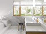 Bath Room and Vessel Sink Carrara marble clads the spacious bathroom.  Photo 7 of 11 in Smart Tech Makes this Modern Home Ultra Energy Efficient