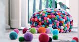 Each Bommel (also known as Pompon) Pouf by German designer MYK is hand-crafted and is comprised of 750 colorful pompoms.