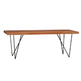 The Dylan Dining Table by CB2 takes a hardwood slab, pairs it with metal, and creates a tailored silhouette. Minimal and always in style.