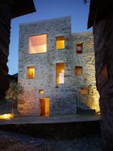 The renovation of this old stone structure by Wespi de Meuron Romeo architects was, at times, as much archeology as architecture. The small square in front of the building, the only in the village of Scaiano, dates the building, a former brandy distillery fortified with both spiritis and stone walls. After reinforcing the roof and replacing the wood beam floors with concrete, the team started to dig in.