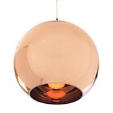 Lighting designer Tom Dixon released this pendant lamp in 2006 at the Milan Furniture Fair. The shade is constructed of plastic polycarbonate and sheathed in a mirror-like copper finish. See more of the Copper Shade Pendant Lamp here.