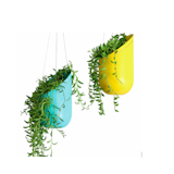 Transform all earthbound flora into veritable air plants with these powder-coated, spun-aluminum, pill-shaped planters. Read  more about these hanging planters here.