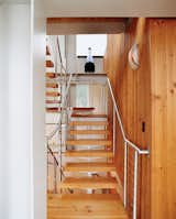 The stairs and the wood paneling were designed and built by wood-worker Noah Israel, a longtime neighbor and friend. Read more about this mountaintop dwelling here.