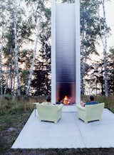 Designer Philippe Starck’s outdoor chairs for Kartell provide cozy fireside seating. See more of our story, "Off the Beaten Path" here. Photo by: Chad Holder (Pin)