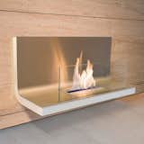 Designed by Michael Rosing, this stainless steel and glass wall-mounted fireplace is fit for any contemporary space. Via Lumens. (Pin)  Photo 5 of 6 in Pinboard of the Day: Fireplaces by Eujin Rhee
