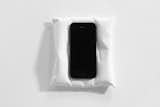 Pillow smartphone rest by Snarkitecture, $85 at shop.snarkitecture.com

Riffing on Snarkitecture's large-scale installation work, their desktop piece appears plush but is cast in durable white gypsum cement. It serves as a resting place for a smartphone; a small niche on the bottom holds a charging cable.  Search “professor acorn pillow” from  Holiday Gift Guide 2014: For the Tech Geek